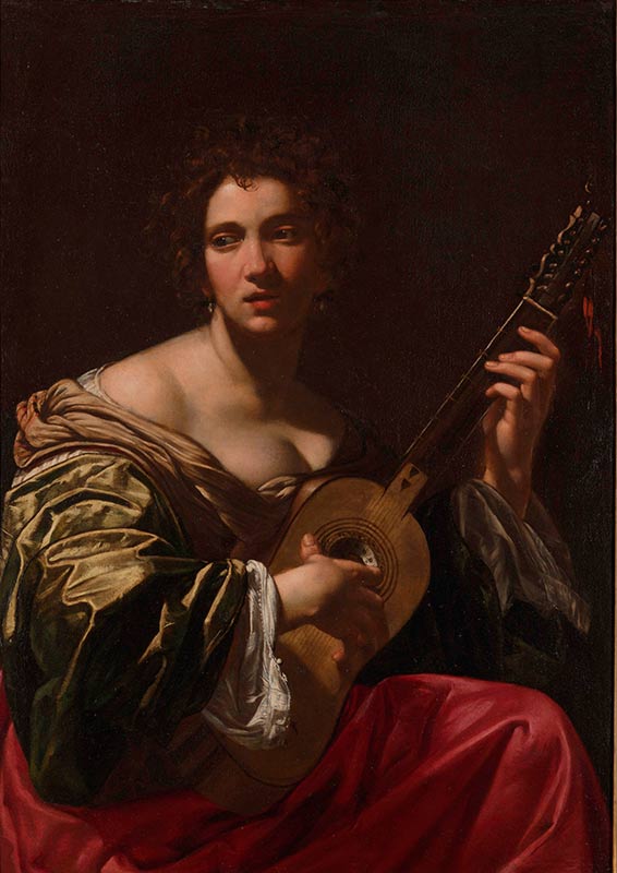 Женщина, играющая на гитаре